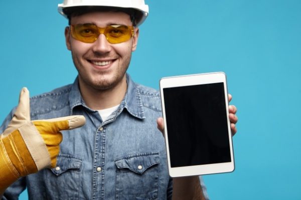 close-up-of-handsome-friendly-looking-young-unshaven-male-mechanic-or-plumber-in-yellow-gloves_343059-3536